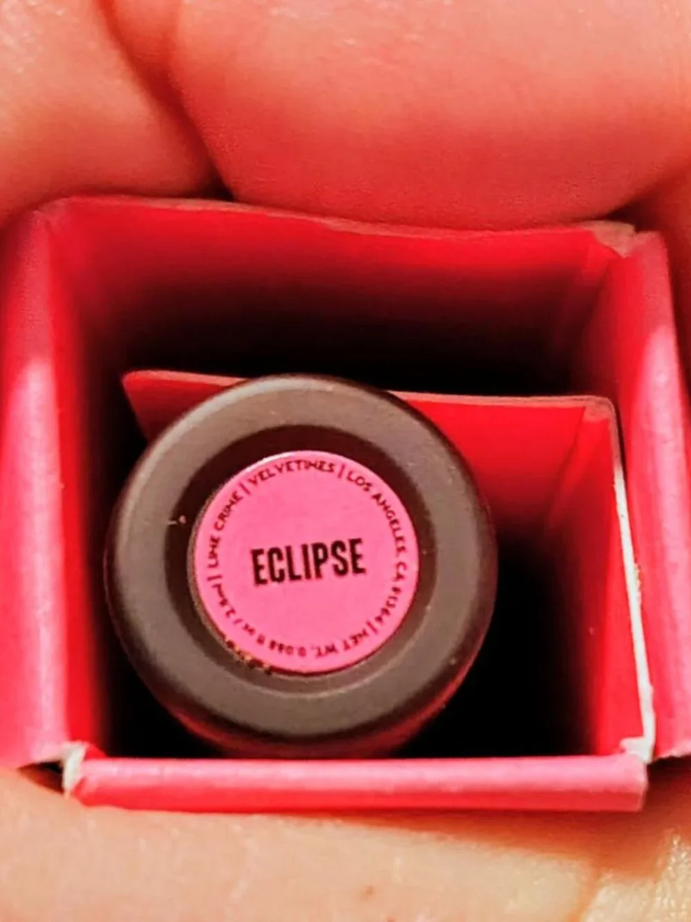 Lime Crime Eclipse is a muted, earthy-toned metallic